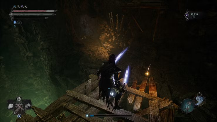 player standing at the edge of a wooden bridge near an umbral flowerbed lords of the fallen